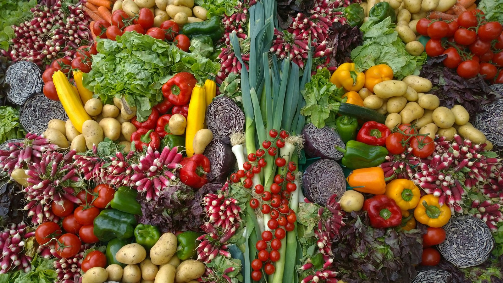 variety of fresh vegetables on wooden cutting board