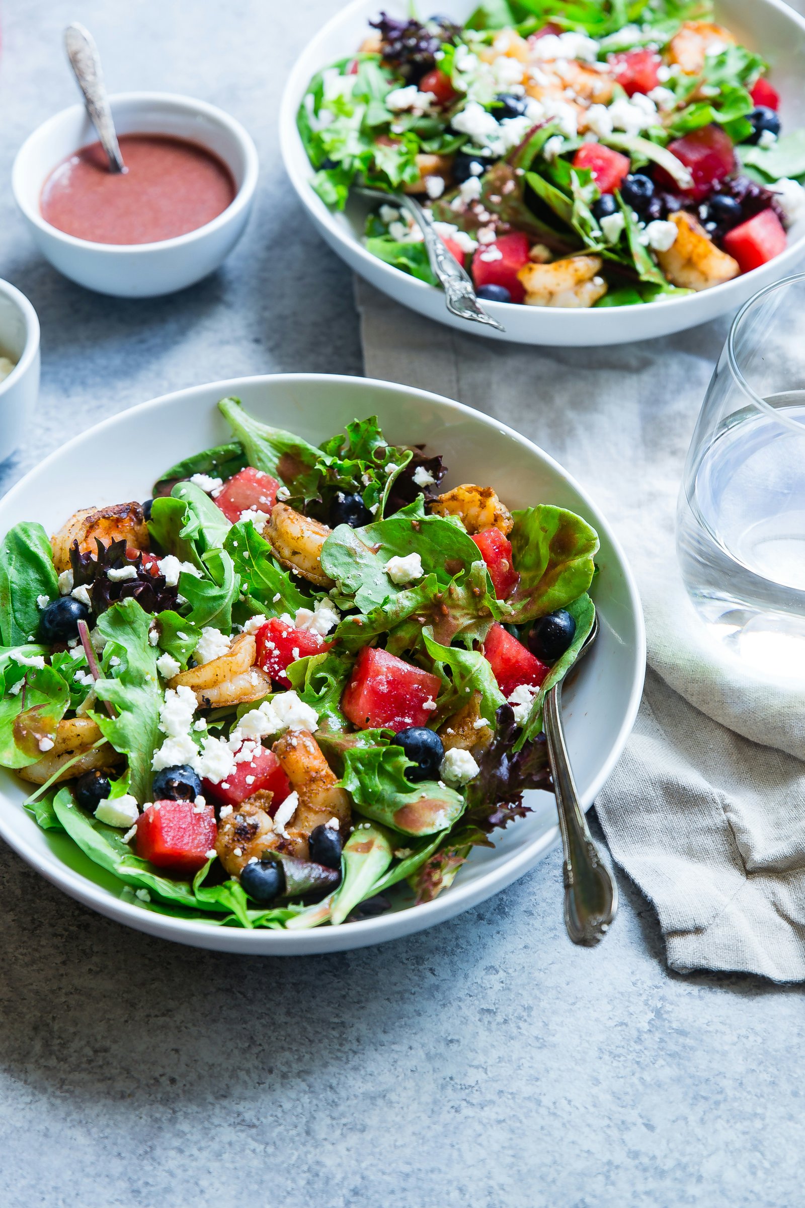 vegetable salad bowl with dressing drizzle